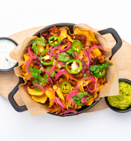 Beef nachos with cheese and pickled onions